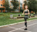 girl at the stadium is jogging.